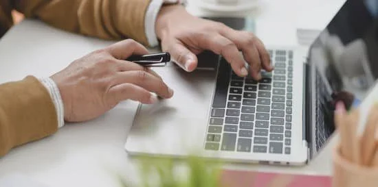 Image of a person working on a computer possibly on a personal or professional development site.