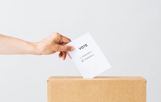 A person putting a vote into a box representing Democratic Leadership Style