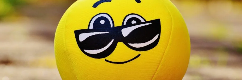 Image of a smiley face with sunglasses.