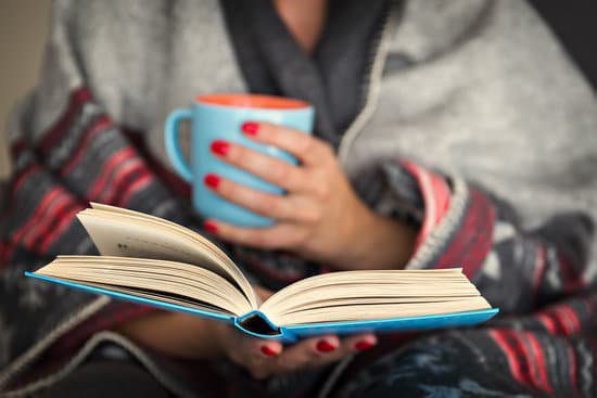 Image of a woman using her downtime to read a book and grow as a person.