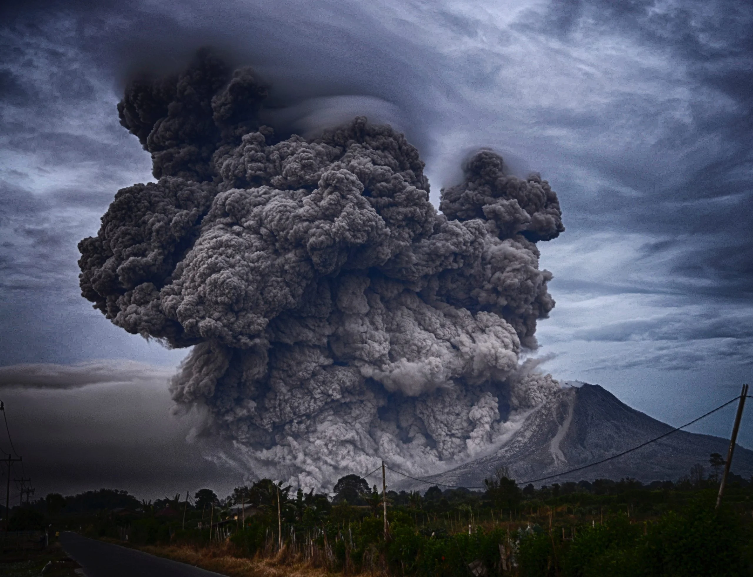 Image of exploding volcano representing a boss, leader, supervisor, manger blowing up at employees.