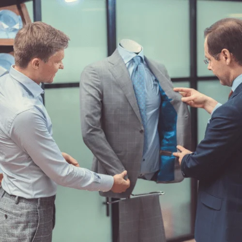 Image of two men looking at a suit for their professional image, personal image, image branding, personal branding.