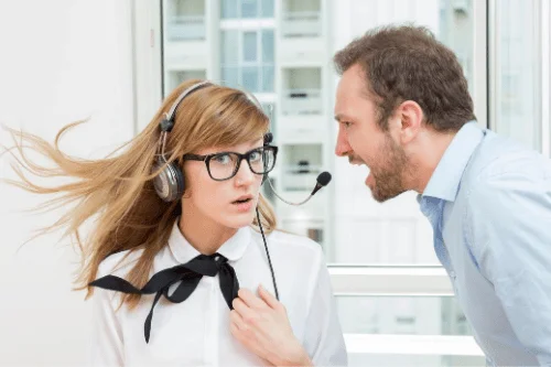 Image of employee being yelled at for having to deal with under performing employees.