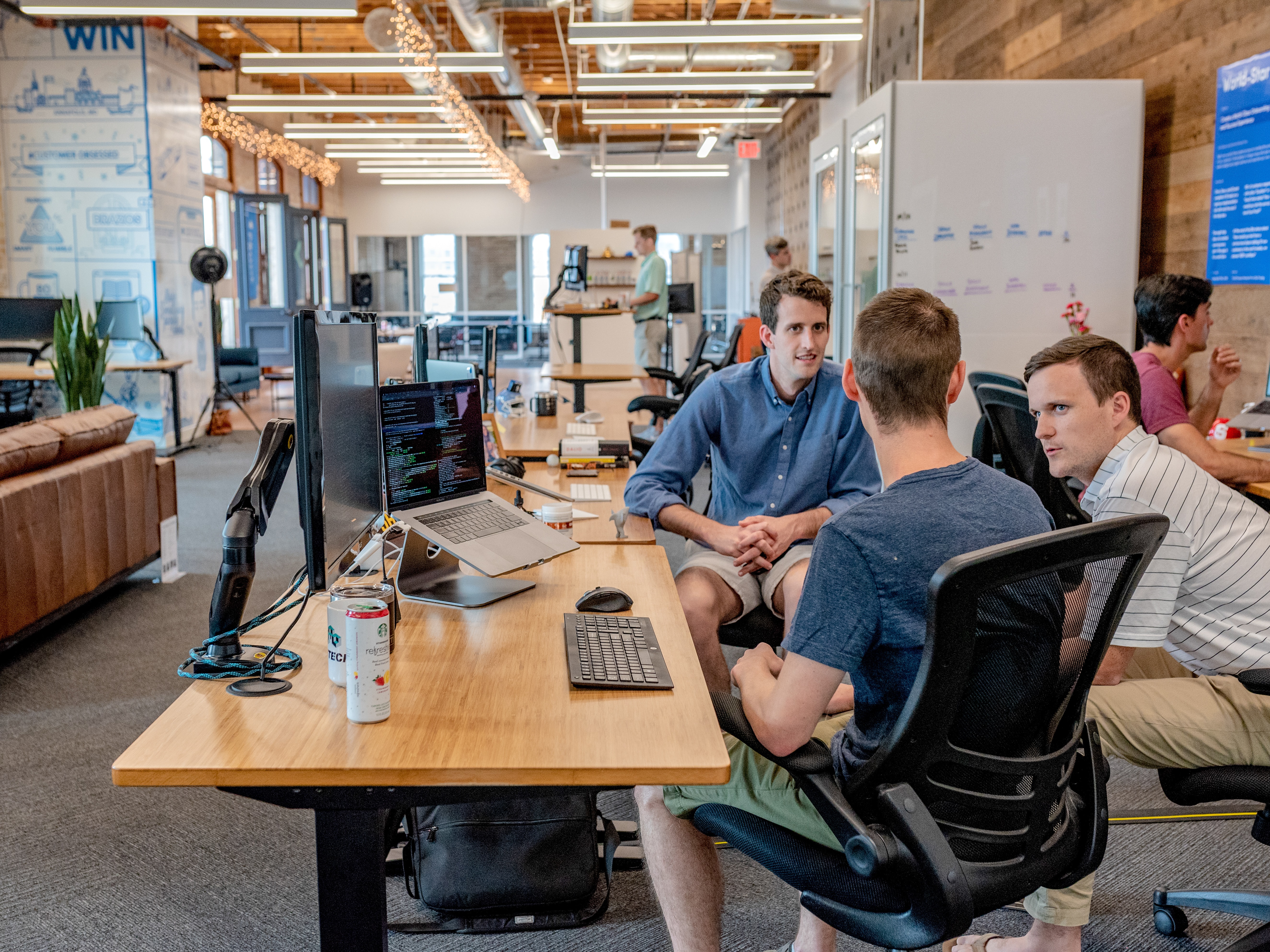 People sitting at a table talking about how to build trust in the workplace