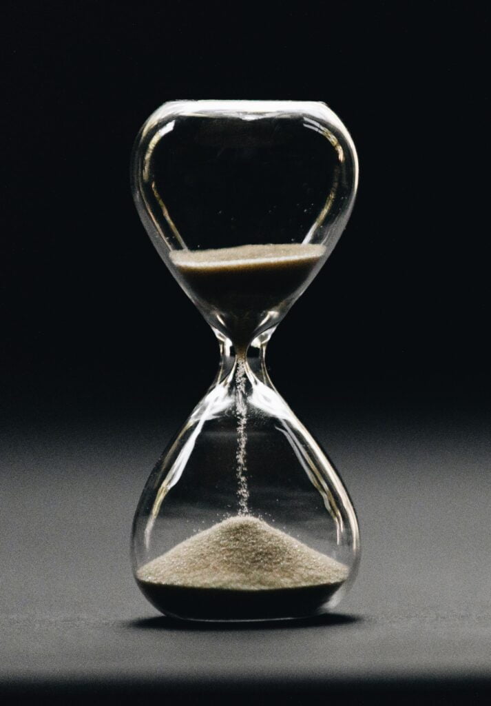 An hour glass running out of time to show the importance of time management.