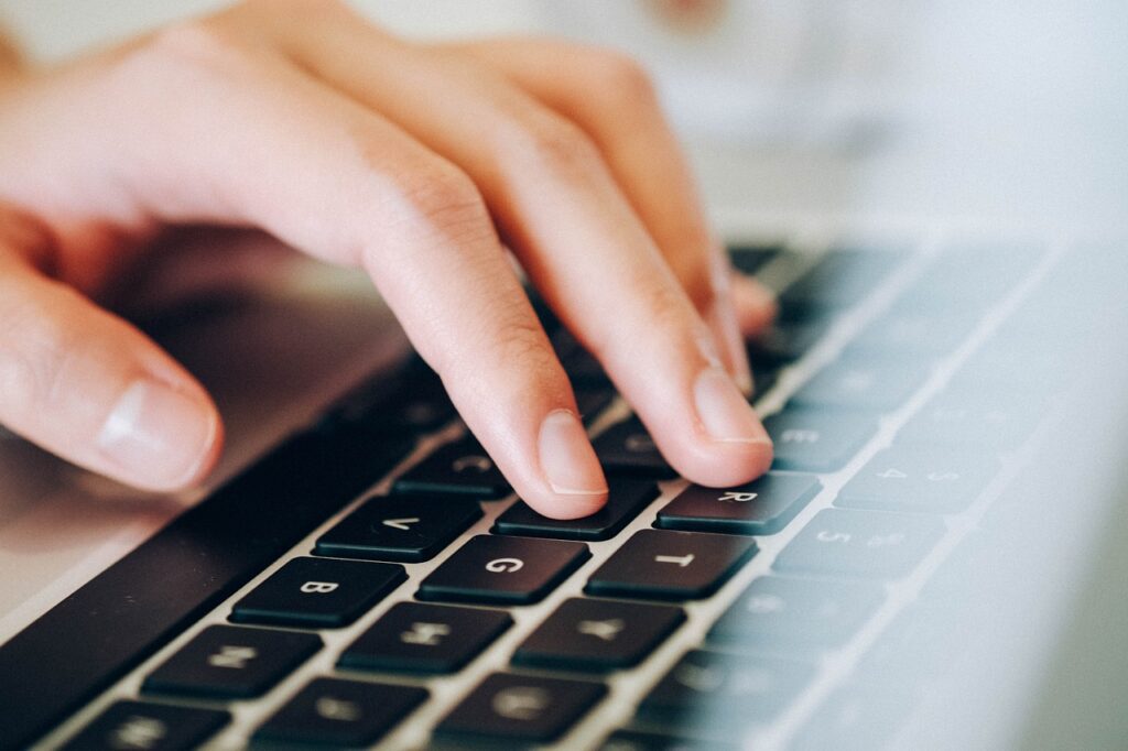 person looking up some workforce planning tools on a computer.