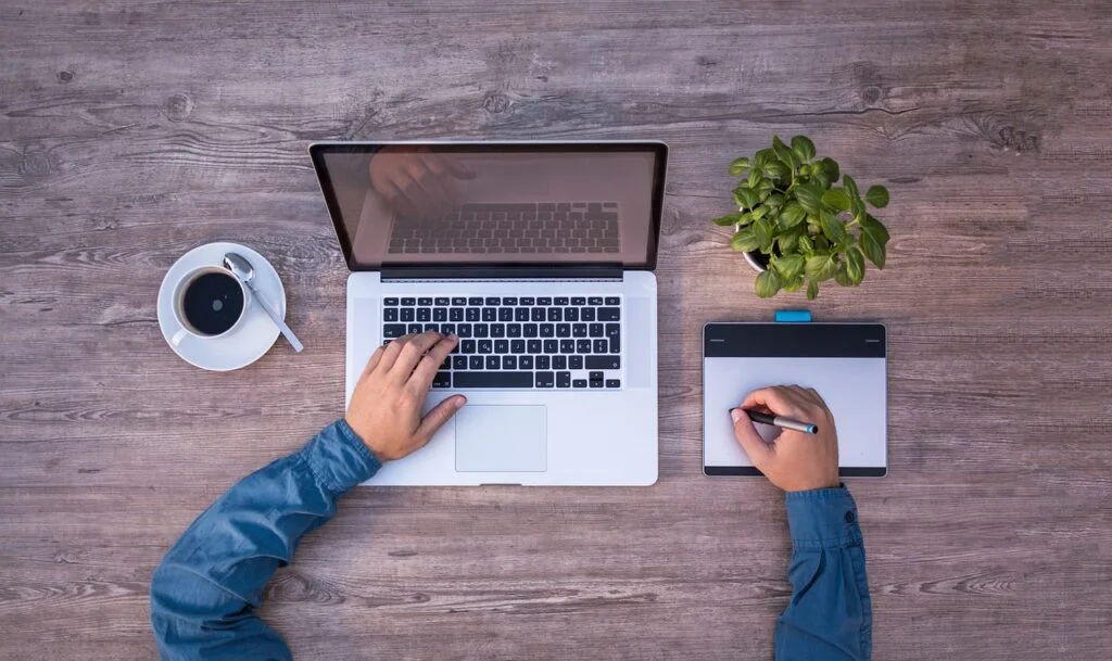 person working on a laptop being productive.