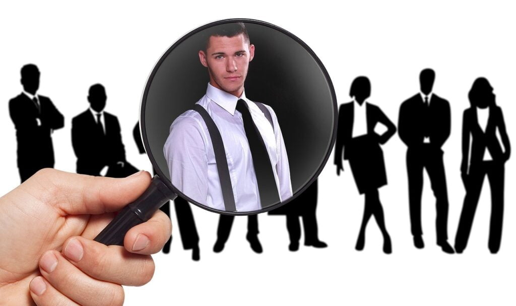 magnifying glass on a person with a collaborative mindset